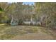 Quaint home with a welcoming porch framed by mature trees, creating a serene setting at 4401 Prices Bridge Ln, Walterboro, SC 29488