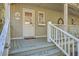 Inviting front porch with a view, features a sign, plants, and white railings at 4401 Prices Bridge Ln, Walterboro, SC 29488