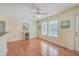 Living room area features hardwood flooring and ample natural light from multiple windows at 4401 Prices Bridge Ln, Walterboro, SC 29488