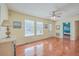 Open living area with wood floors, natural light, and views into the bunkroom at 4401 Prices Bridge Ln, Walterboro, SC 29488