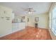 Hardwood floors throughout this open living and kitchen area with ceiling fan and natural light at 4401 Prices Bridge Ln, Walterboro, SC 29488
