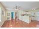Open-concept living room flows to kitchen area with hardwood floors and lots of natural light at 4401 Prices Bridge Ln, Walterboro, SC 29488