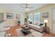 Comfortable living room with hardwood floors, sofa, coffee table, and lots of natural light at 4401 Prices Bridge Ln, Walterboro, SC 29488