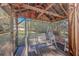 Relaxing screened porch with swing, providing a serene outdoor space at 4401 Prices Bridge Ln, Walterboro, SC 29488