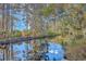 Picturesque waterfront view with trees reflecting in the tranquil canal at 4401 Prices Bridge Ln, Walterboro, SC 29488