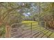 Large fenced yard with a view of the home creates a secure space for outdoor activities at 4401 Prices Bridge Ln, Walterboro, SC 29488