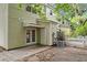 The backyard features a cozy patio area with an air conditioning unit and a quaint picket fence at 4591 Great Oak Dr, North Charleston, SC 29418