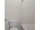 Bright bathroom featuring a toilet and tub with tiled walls at 4591 Great Oak Dr, North Charleston, SC 29418