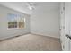 Cozy bedroom with plush carpet, bright window, and neutral walls at 4591 Great Oak Dr, North Charleston, SC 29418