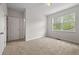 Inviting bedroom with large window, ceiling fan, and neutral carpet at 4591 Great Oak Dr, North Charleston, SC 29418