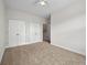 Spacious bedroom with plush carpet, ceiling fan, and double closets at 4591 Great Oak Dr, North Charleston, SC 29418