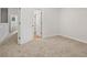 Second floor bedroom with neutral carpeting and light wood-look flooring visible through doorway at 4591 Great Oak Dr, North Charleston, SC 29418