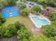 Aerial view of the pool, basketball, and tennis courts in a beautifully landscaped community at 4591 Great Oak Dr, North Charleston, SC 29418