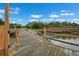 Wooden dock stretching out into the marsh with beautiful landscape views at 4591 Great Oak Dr, North Charleston, SC 29418