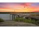 Beautiful sunset view over the water from a wooden dock at 4591 Great Oak Dr, North Charleston, SC 29418