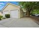 A charming townhome features an attached garage with a driveway and well-maintained landscaping at 4591 Great Oak Dr, North Charleston, SC 29418