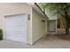 A one-car garage is attached to this home with a door to a separate entrance and neutral siding at 4591 Great Oak Dr, North Charleston, SC 29418
