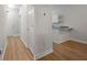 Bright hallway with wood-look floors leading to the front door and a small office space at 4591 Great Oak Dr, North Charleston, SC 29418