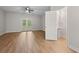 Spacious living room featuring wood-look floors, ceiling fan and french doors leading to the outdoors at 4591 Great Oak Dr, North Charleston, SC 29418