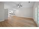 Living room featuring wood floors and a door to the outside as well as view of the kitchen at 4591 Great Oak Dr, North Charleston, SC 29418