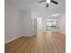 The living room features wood floors and view through a hall to the kitchen and front door of the house at 4591 Great Oak Dr, North Charleston, SC 29418