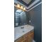 Neutral toned bathroom featuring a framed mirror, vanity and lighting fixture at 5088 Thornton Dr, Summerville, SC 29485