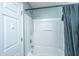 Shower and tub combination with shower curtain and ample lighting at 5088 Thornton Dr, Summerville, SC 29485