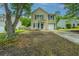Charming two-story home with vinyl siding, a front yard, and driveway at 5088 Thornton Dr, Summerville, SC 29485