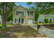 Charming home with blue shutters, an attached garage and a manicured yard, all under a blue sky at 5088 Thornton Dr, Summerville, SC 29485