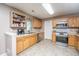 Well-appointed kitchen with stainless steel appliances, wood cabinets, and ample counter space at 5088 Thornton Dr, Summerville, SC 29485