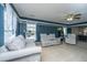 Cozy living room featuring comfortable seating, a ceiling fan and natural light at 5088 Thornton Dr, Summerville, SC 29485