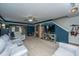 View of the home's living room with tv and staircase at 5088 Thornton Dr, Summerville, SC 29485
