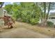 Expansive backyard featuring a lush green landscape and a charming patio area at 522 Tayrn Dr, Wando, SC 29492