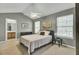Relaxing bedroom featuring a cozy queen bed, ensuite access and natural light for a peaceful retreat at 522 Tayrn Dr, Wando, SC 29492