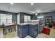Open dining room with stylish chandelier, natural light, and access to the living area at 522 Tayrn Dr, Wando, SC 29492