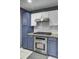 Well-appointed kitchen with stainless steel appliances and two-tone cabinets at 522 Tayrn Dr, Wando, SC 29492