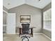 Bright home office featuring a work desk, comfortable chair, and a large window for a productive workspace at 522 Tayrn Dr, Wando, SC 29492