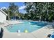 A swimming pool with lounge chairs and beach balls, inviting outdoor fun at 522 Tayrn Dr, Wando, SC 29492