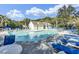 Community pool with abundant lounge chairs and a cabana, perfect for relaxation at 522 Tayrn Dr, Wando, SC 29492