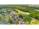 Aerial image of a residential area near a pond and golf course, showing the landscape and neighborhood layout at 5258 Mulholland Dr, Summerville, SC 29485