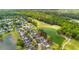 Drone shot showcasing homes bordering a golf course and serene pond at 5258 Mulholland Dr, Summerville, SC 29485