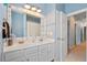 Charming bathroom featuring a double sink vanity and decorative mirror at 5258 Mulholland Dr, Summerville, SC 29485