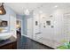 Stylish bathroom showcasing a glass shower with white tile and a chandelier at 5258 Mulholland Dr, Summerville, SC 29485