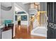 Inviting foyer with hardwood floors, staircase, and views into the dining room, creating an open and elegant entrance at 5258 Mulholland Dr, Summerville, SC 29485