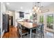 Bright eat-in kitchen boasts a large island, pendant lighting, and access to the back deck through French doors at 5258 Mulholland Dr, Summerville, SC 29485