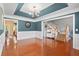 Open-concept living room with hardwood floors and staircase leading to the second floor at 5258 Mulholland Dr, Summerville, SC 29485