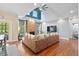 Cozy living room with a stone fireplace, vaulted ceilings, and a large sofa at 5258 Mulholland Dr, Summerville, SC 29485