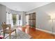 Bright living area featuring hardwood floors, a decorative barn door, and lots of natural light at 5258 Mulholland Dr, Summerville, SC 29485