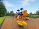 Community playground featuring slides, climbing structures, and a cute yellow spring rider at 5258 Mulholland Dr, Summerville, SC 29485