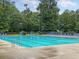 Resort-style community pool with plenty of lounge chairs at 5258 Mulholland Dr, Summerville, SC 29485